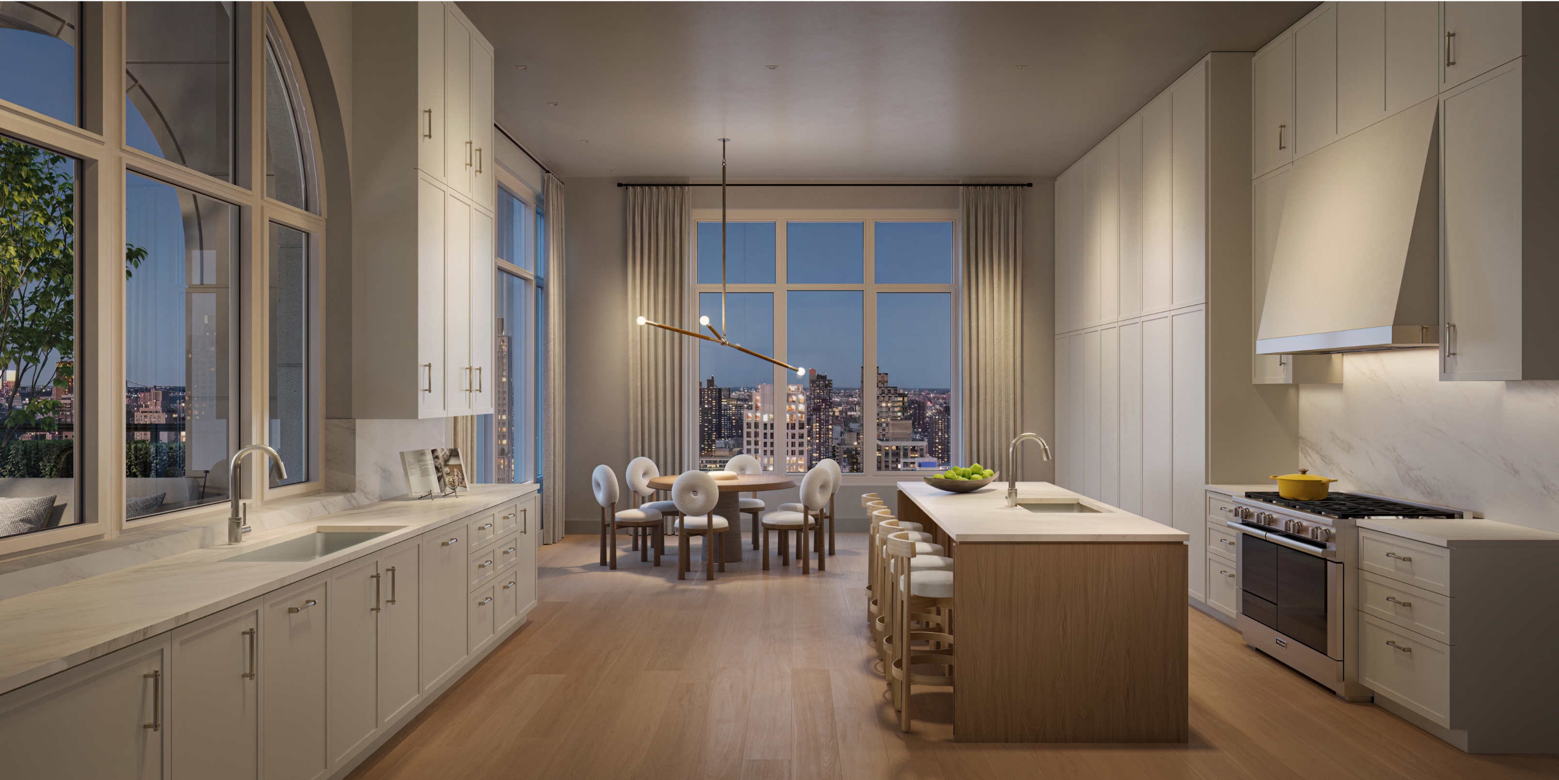 Stylish penthouse kitchen with a dining area and breathtaking city skyline views at 255 East 77, an UES new development.