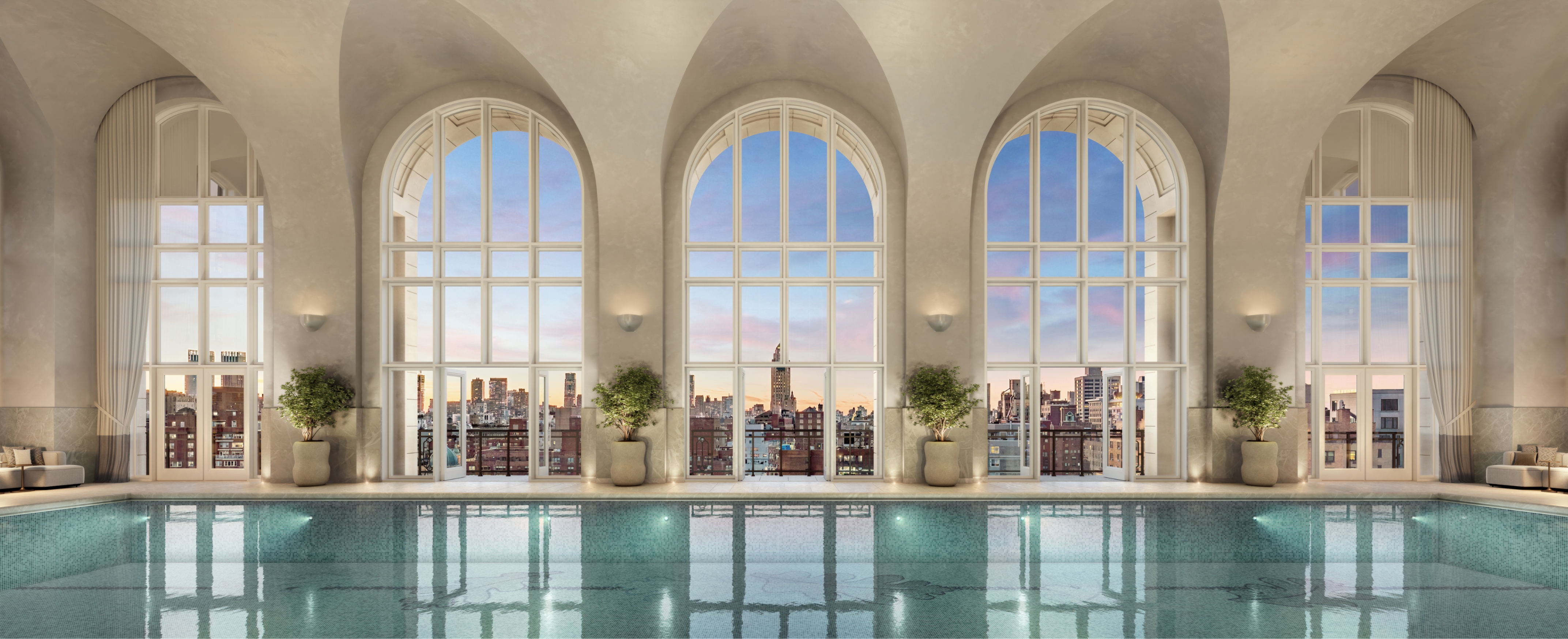 Luxurious pool at 255 East 77 Residences on the Upper East Side, featuring arched windows and stunning NYC skyline views.